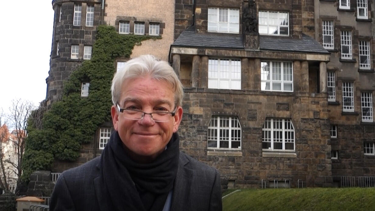 Dipl.-Ing. Christian Peters in front of a building of the TU Dresden