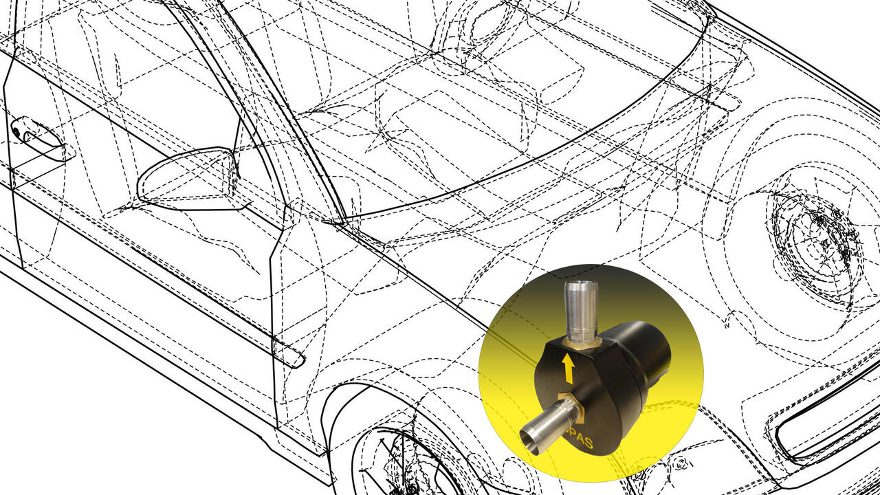 Oil mist separator on yellow background in the engine compartment of a transparent passenger car