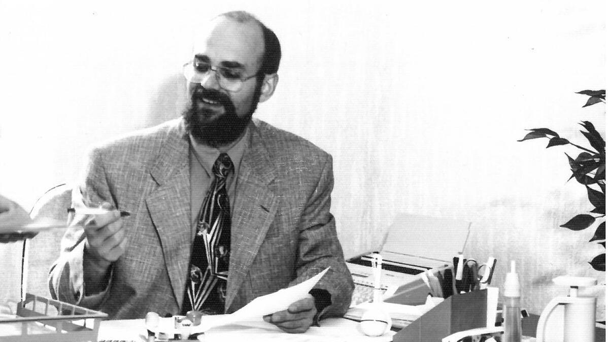 Company founder A. Rudolph at his desk, black and white photograph