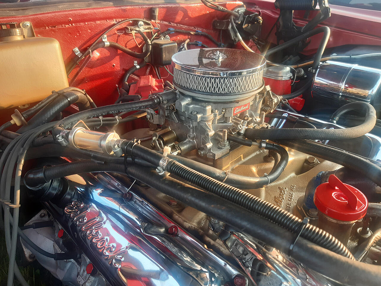 Intake filter in the open engine compartment of an American passenger car